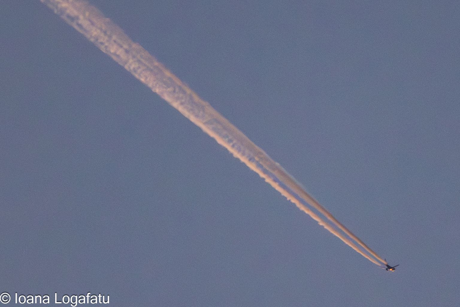 Twilight contrails create a calm scene